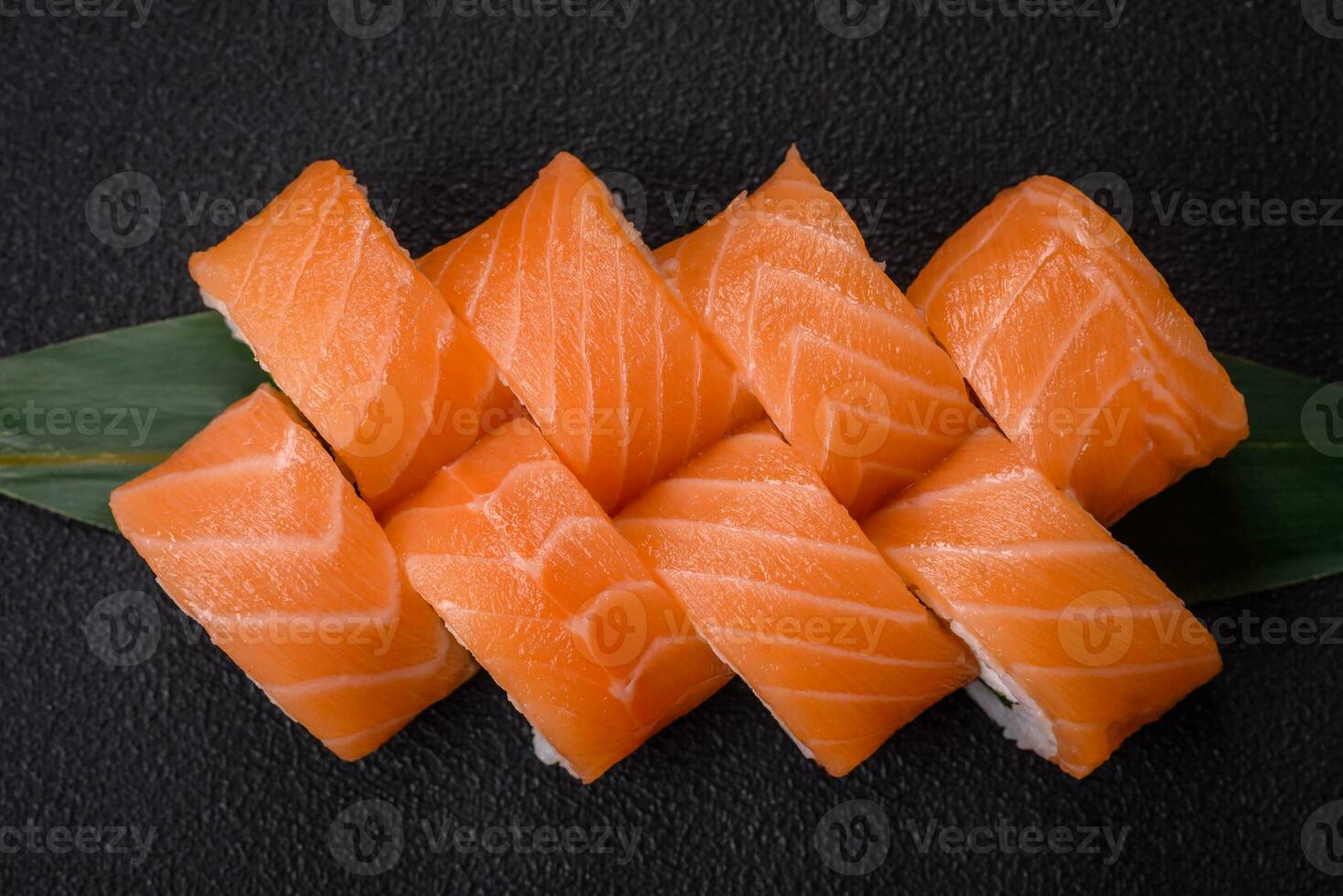 Delicious Philadelphia sushi roll with salmon, shrimp, cucumber and cream cheese photo