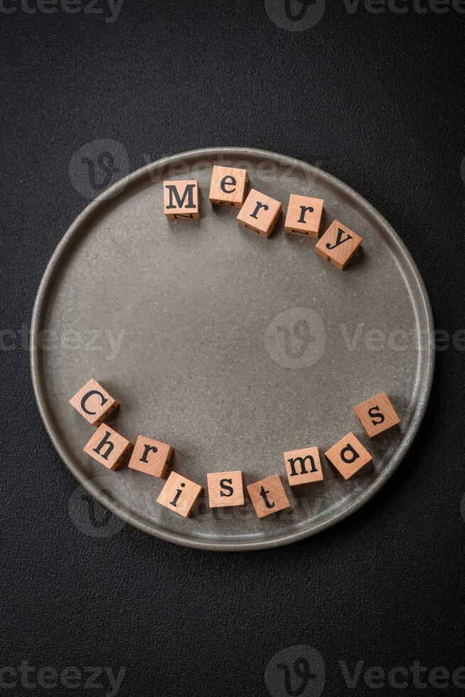 Beautiful Christmas composition with copy space with an inscription in wooden cubes photo