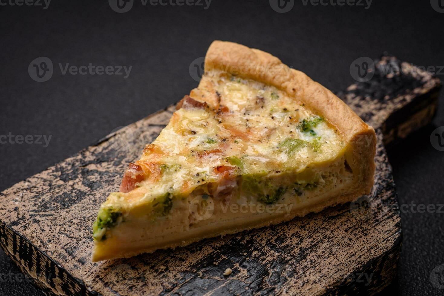 Delicious quiche with broccoli, cheese, chicken, spices and herbs photo