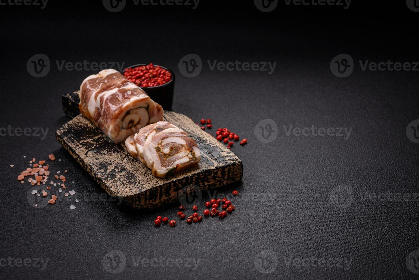 Delicious meatloaf with lard, salt, spices and herbs cut into slices photo