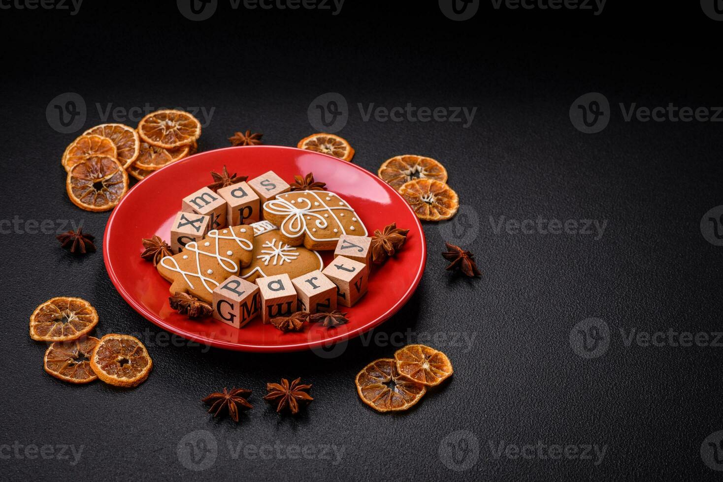 Christmas party inscription with wooden cubes on a dark concrete background photo