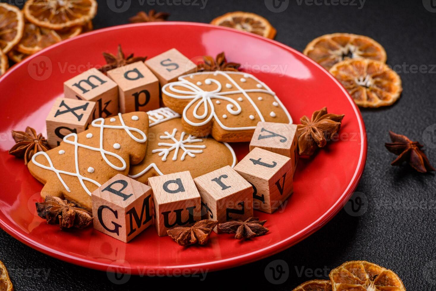 Christmas party inscription with wooden cubes on a dark concrete background photo