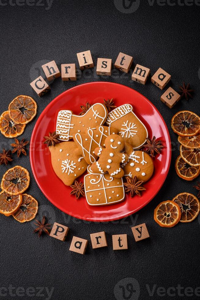 Christmas party inscription with wooden cubes on a dark concrete background photo