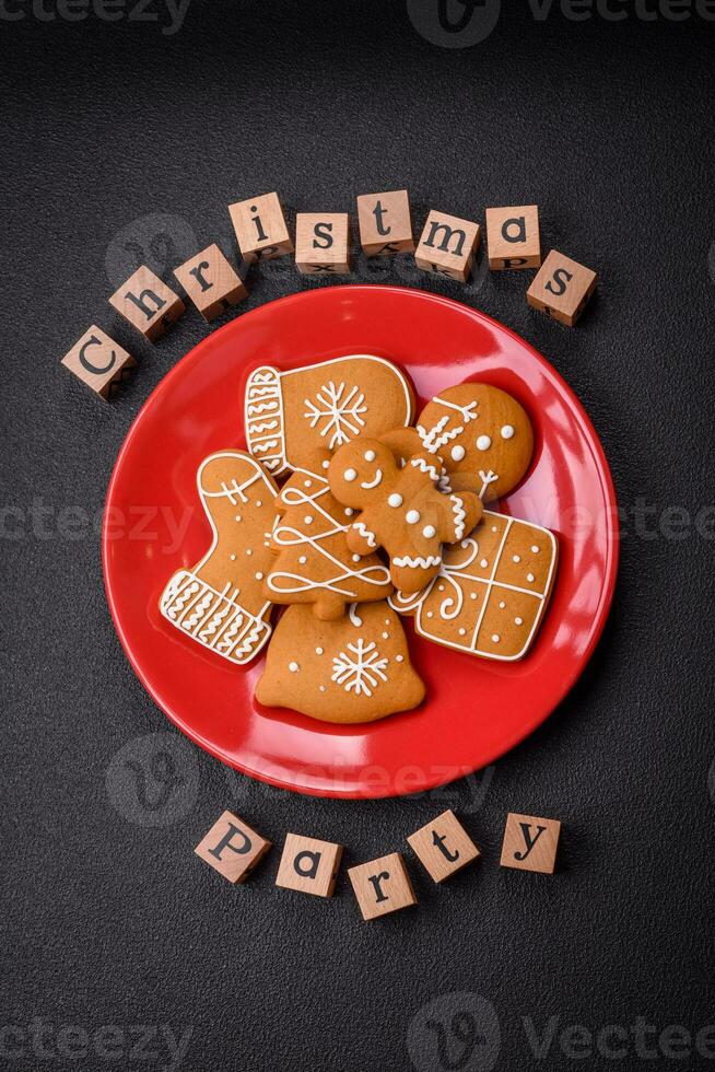 Christmas party inscription with wooden cubes on a dark concrete background photo