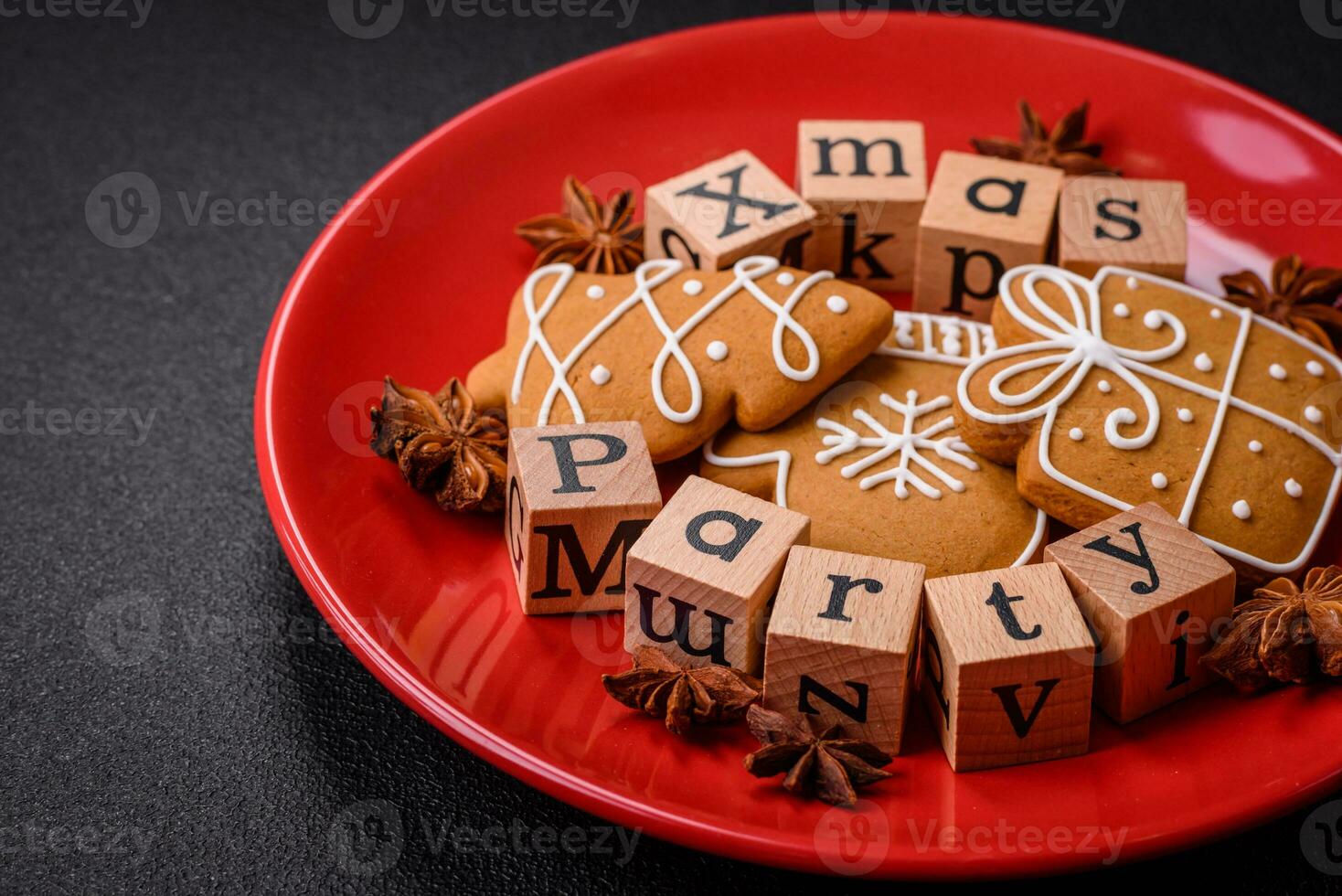 Christmas party inscription with wooden cubes on a dark concrete background photo