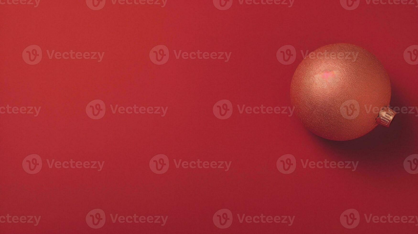 AI Generated A red and gold christmas ornament on a red surface, AI photo