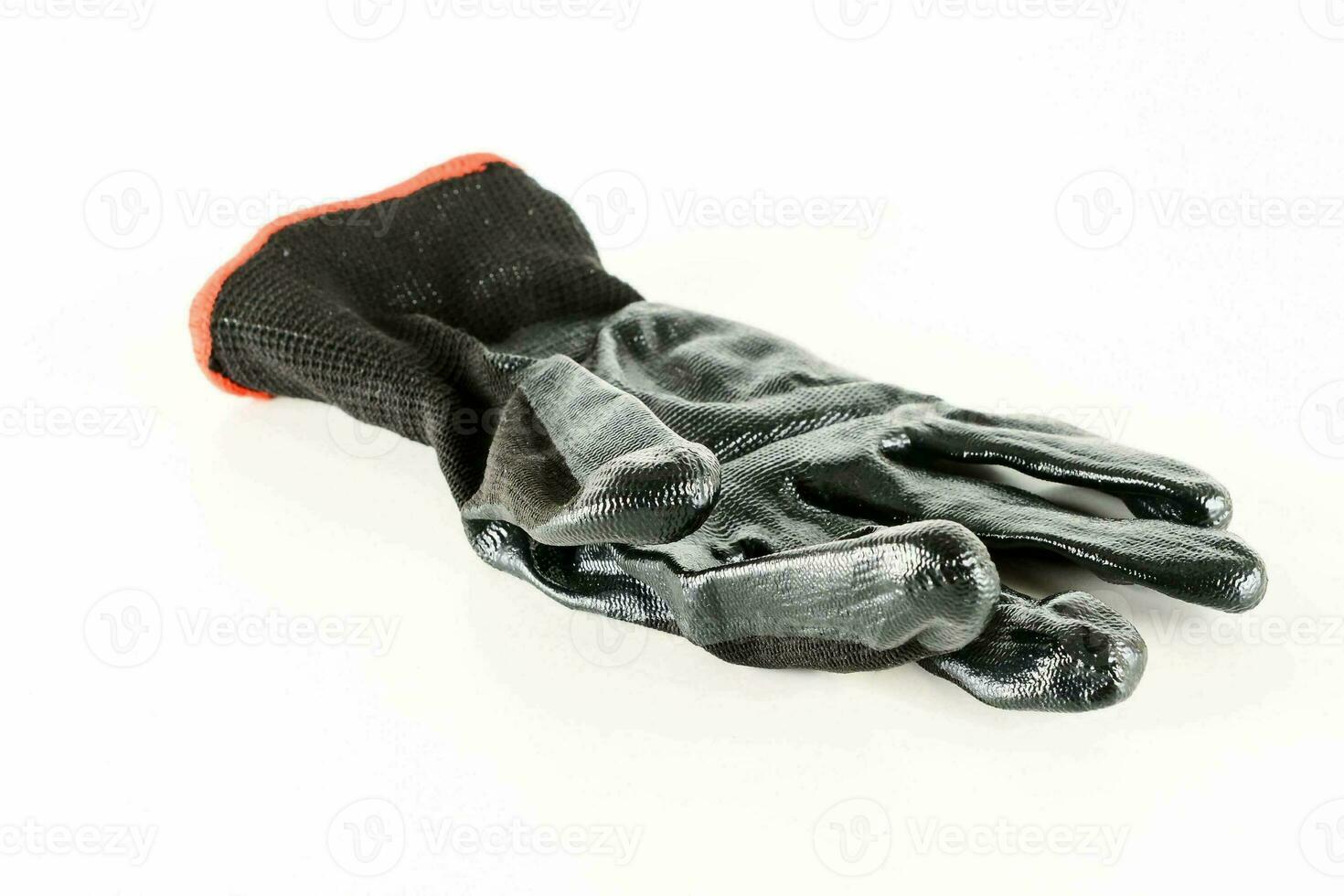 a black glove with red trim photo