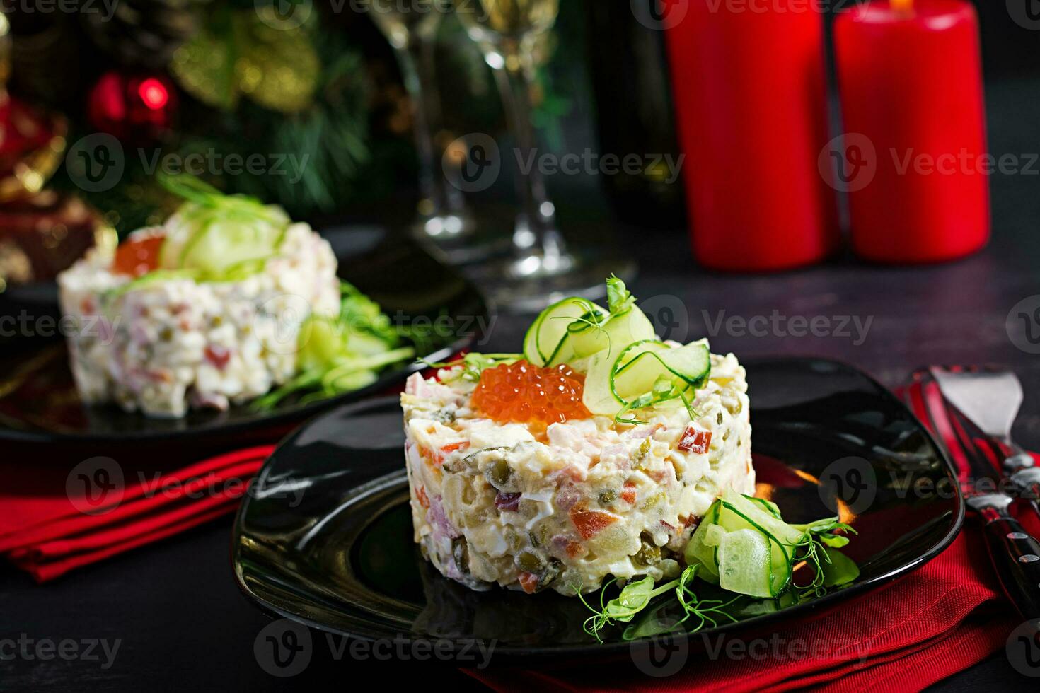 Christmas table setting. Traditional Russian salad Olivier. New Year salad. Festive salad. photo