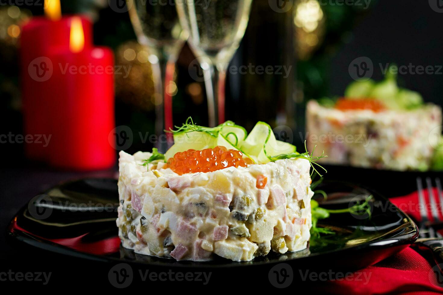 Christmas table setting. Traditional Russian salad Olivier. New Year salad. Festive salad. photo