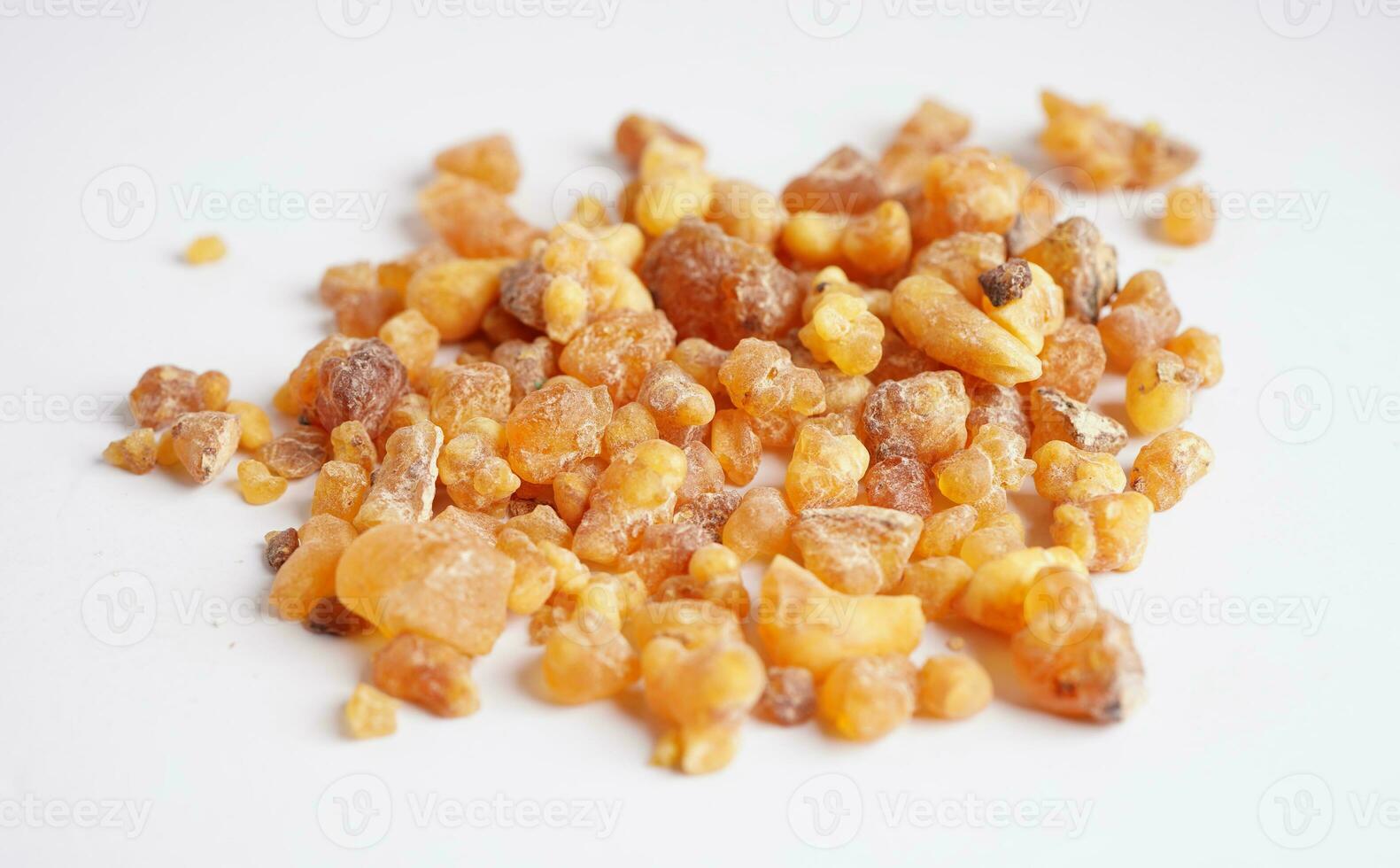 Frankincense or olibanum aromatic resin isolated on white background used in incense and perfumes. photo