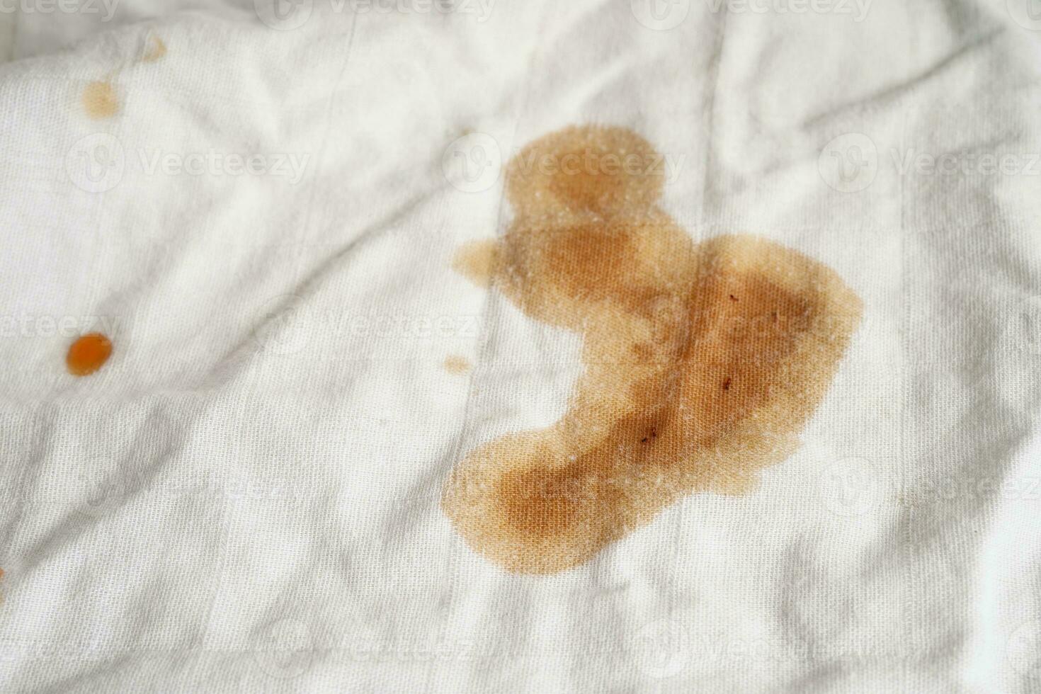 Dirty tomato sauce stain or ketchup on cloth to wash with washing powder, cleaning housework concept. photo