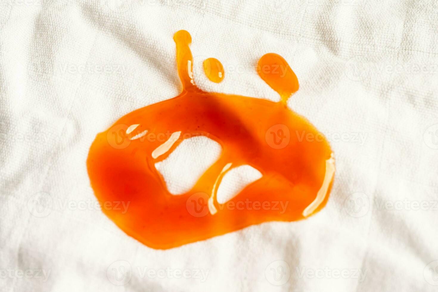 Dirty tomato sauce stain or ketchup on cloth to wash with washing powder, cleaning housework concept. photo