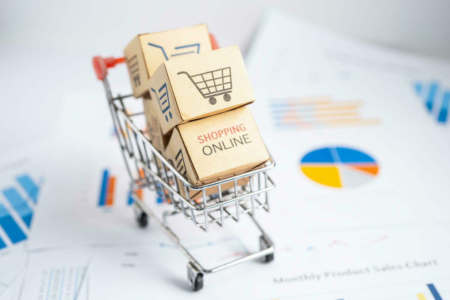 Shopping cart logo on box on graph. Banking Account, Investment economy, trading, Business import export transportation online. photo