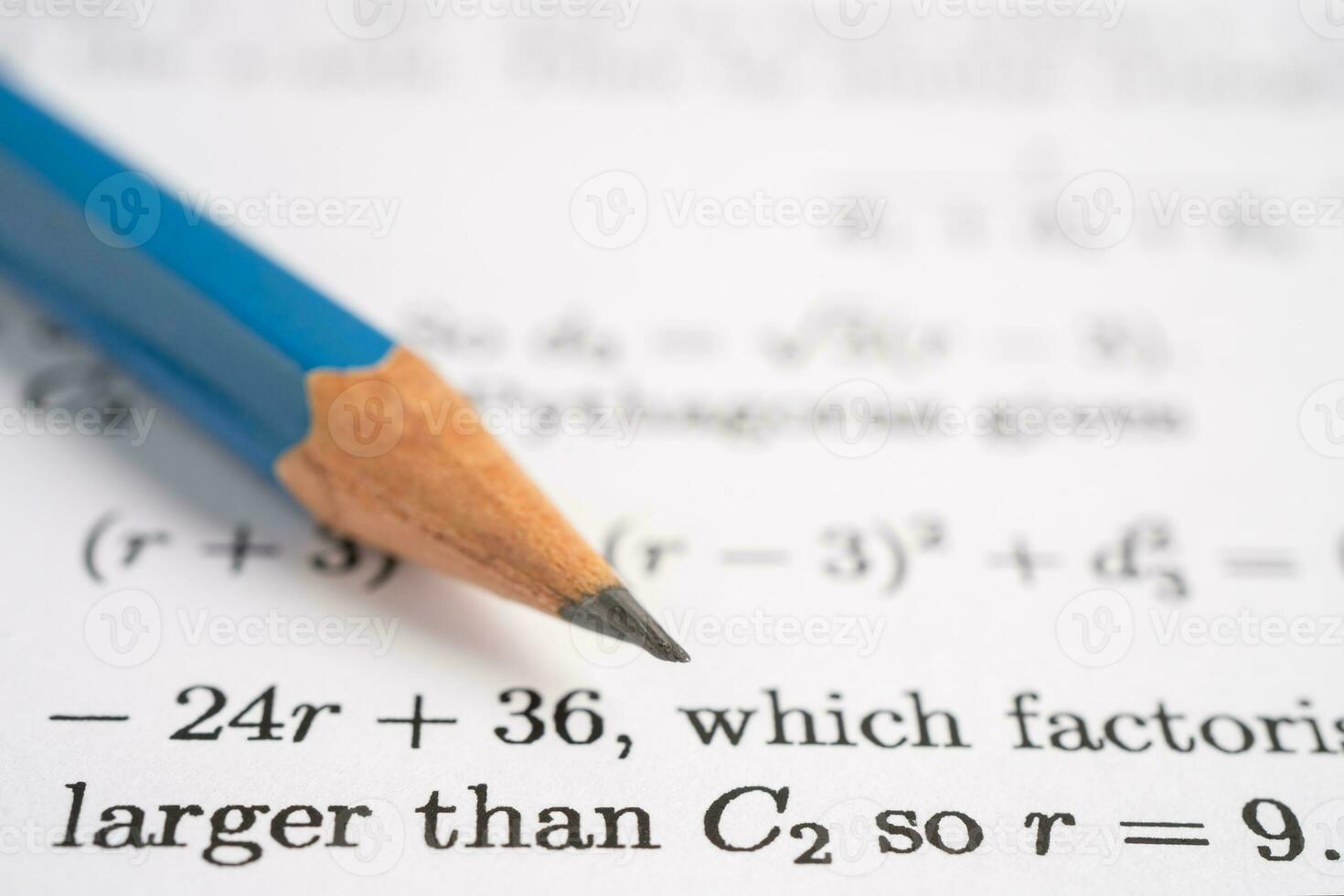 Pencil on mathematic formula exercise test paper in education school. photo