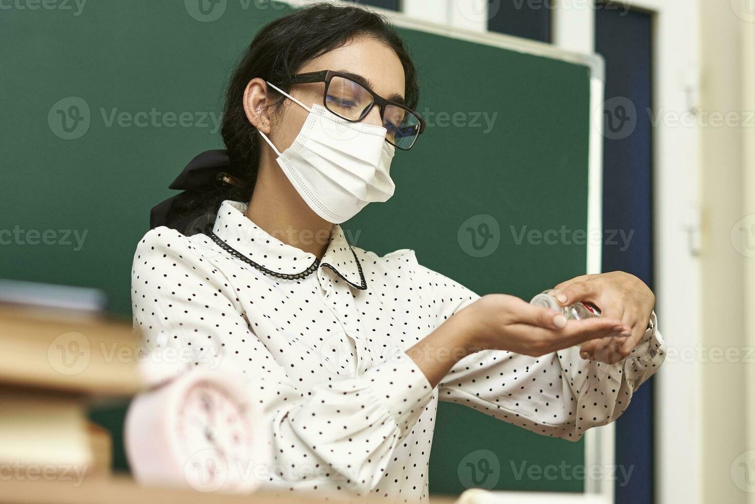 Teacher teaching during covid 19 pandemic photo