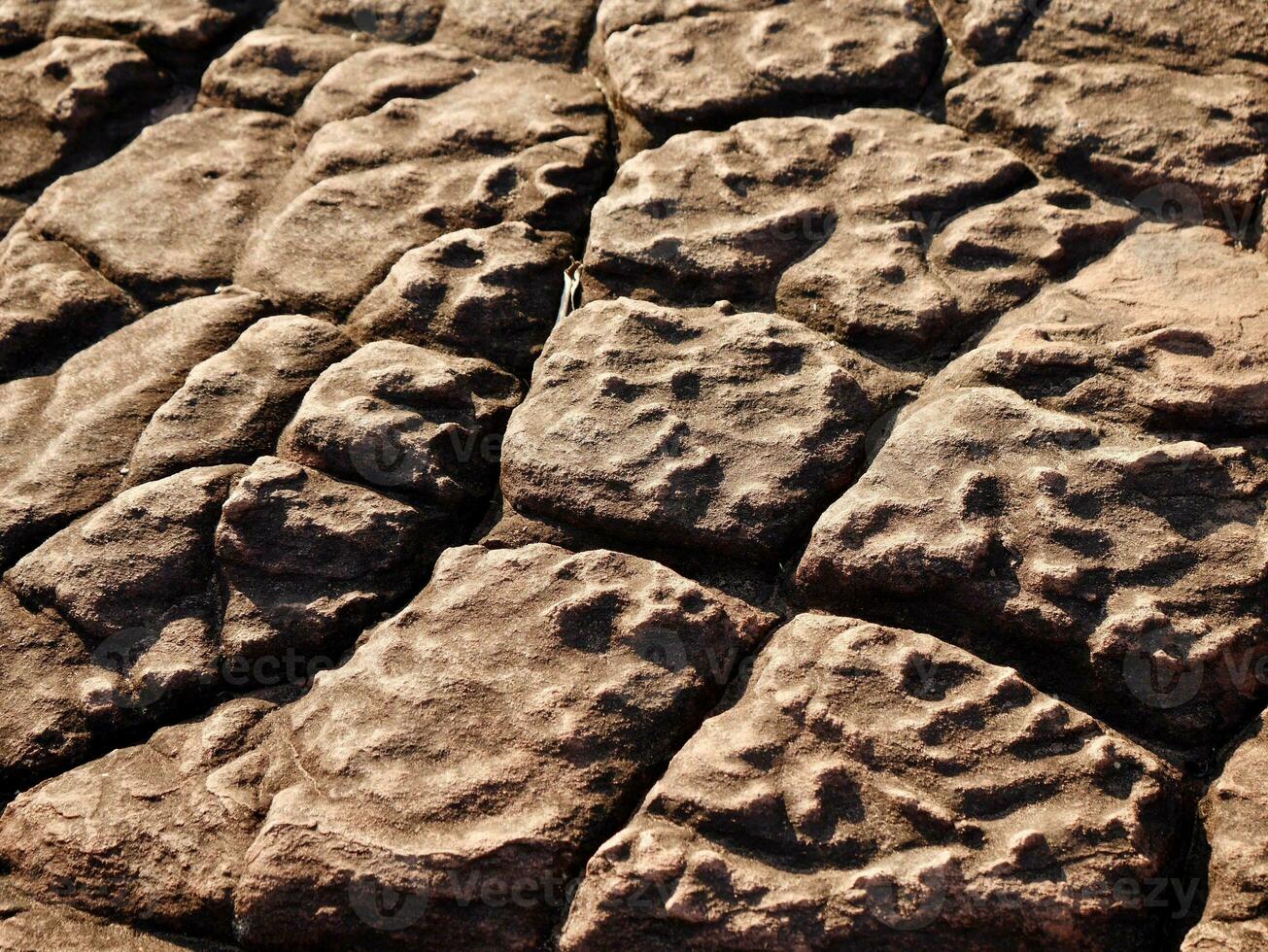 Texture of the natural sandstone cliff in the jungle, landscape of rock or sandstones, gravel sandstone patio floor, Texture of granite rock in Thailand photo