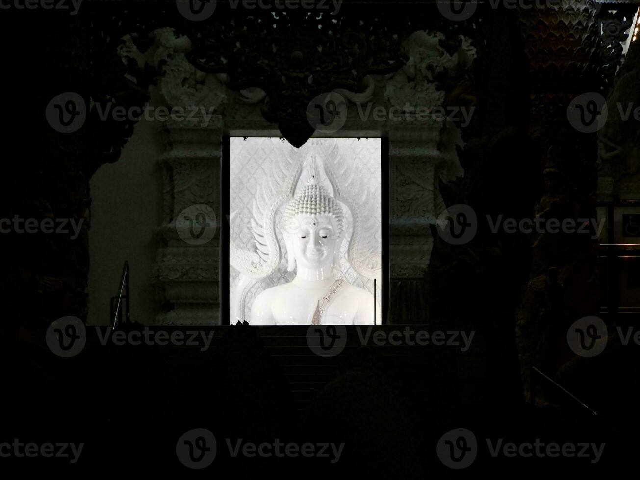 white stone Buddha statue, A beautiful view of wat huai pla kang buddhist temple at Chiang Rai, Thailand, a carved buddha statue made from stone photo