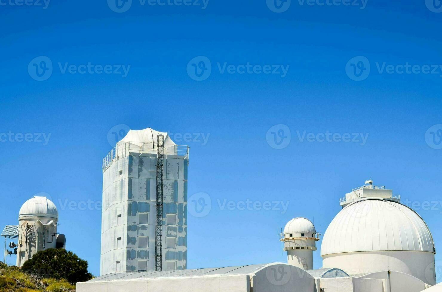 the observatory building with three large telescopes photo