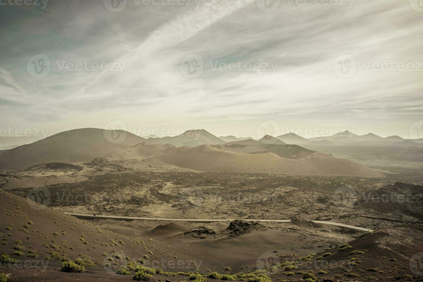 View on the volcanic landscape of Timanfaya National Park on the Canary Island of Lanzarote in Spain. photo
