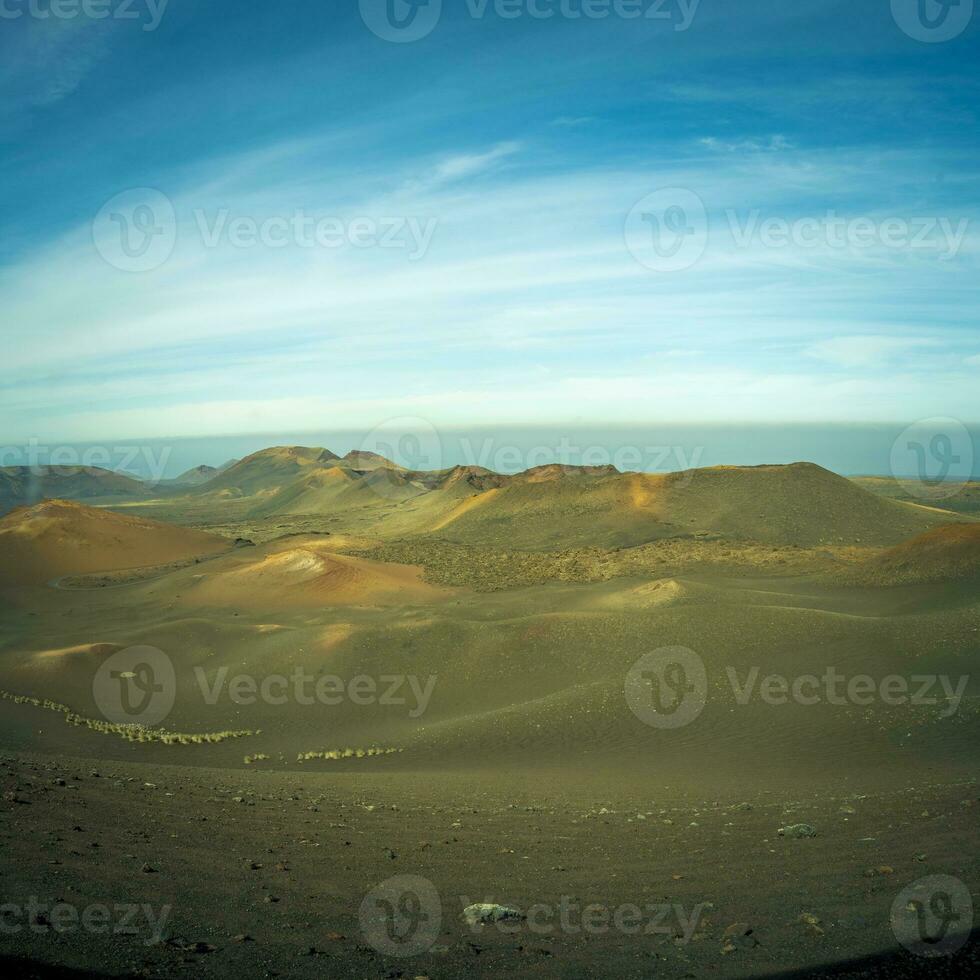 View on the volcanic landscape of Timanfaya National Park on the Canary Island of Lanzarote in Spain. photo