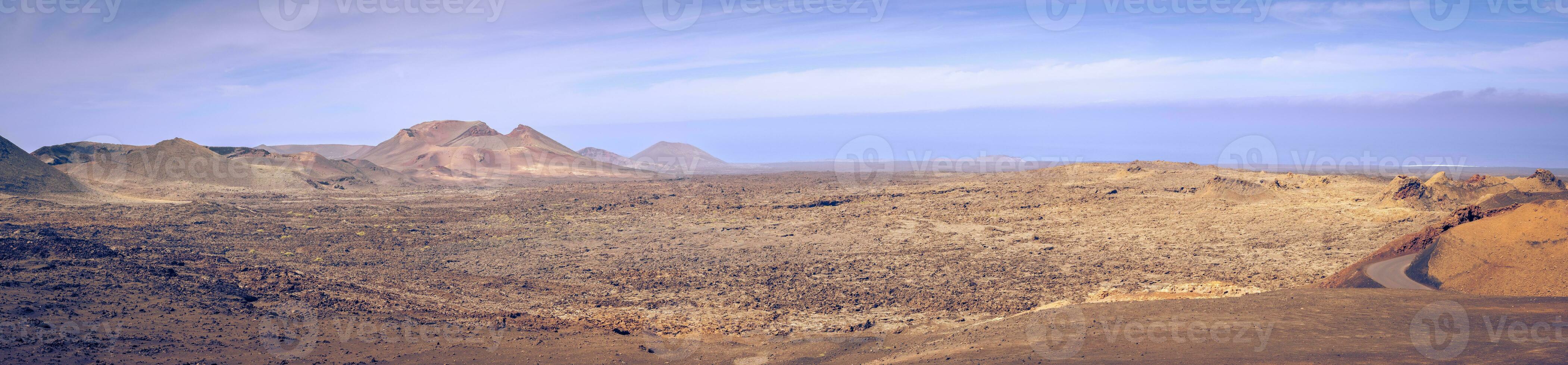 Wide panorama view on the desolate volcanic landscape of Timanfaya National Park on Lanzarote photo