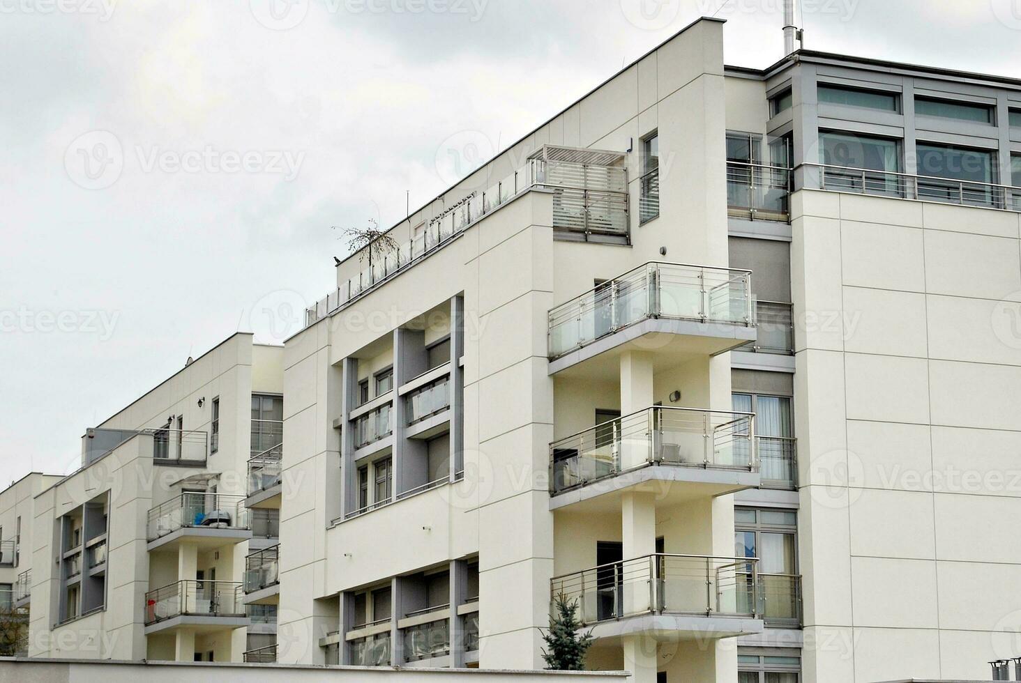 Brand new apartment building on sunny day. Modern residential architecture. Modern multi-family apartment house. photo