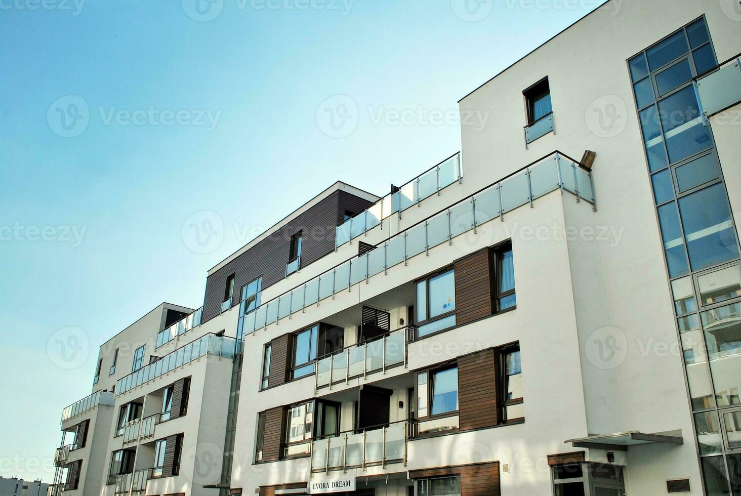 Modern apartment building in sunny day. Exterior, residential house facade. photo