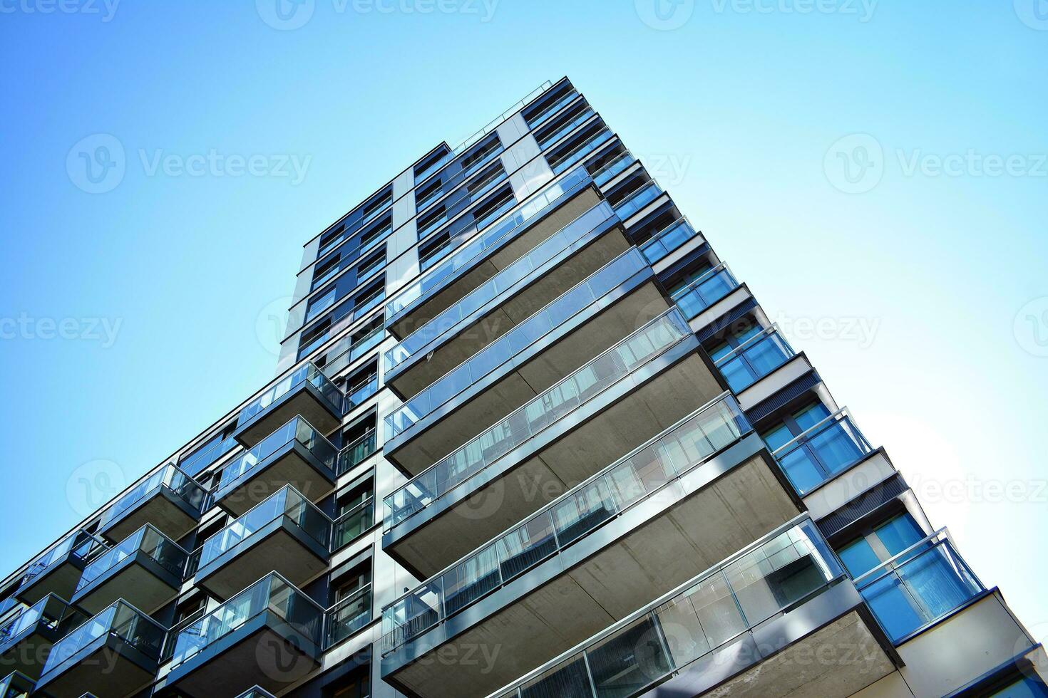 Modern apartment building in sunny day. Exterior, residential house facade. photo