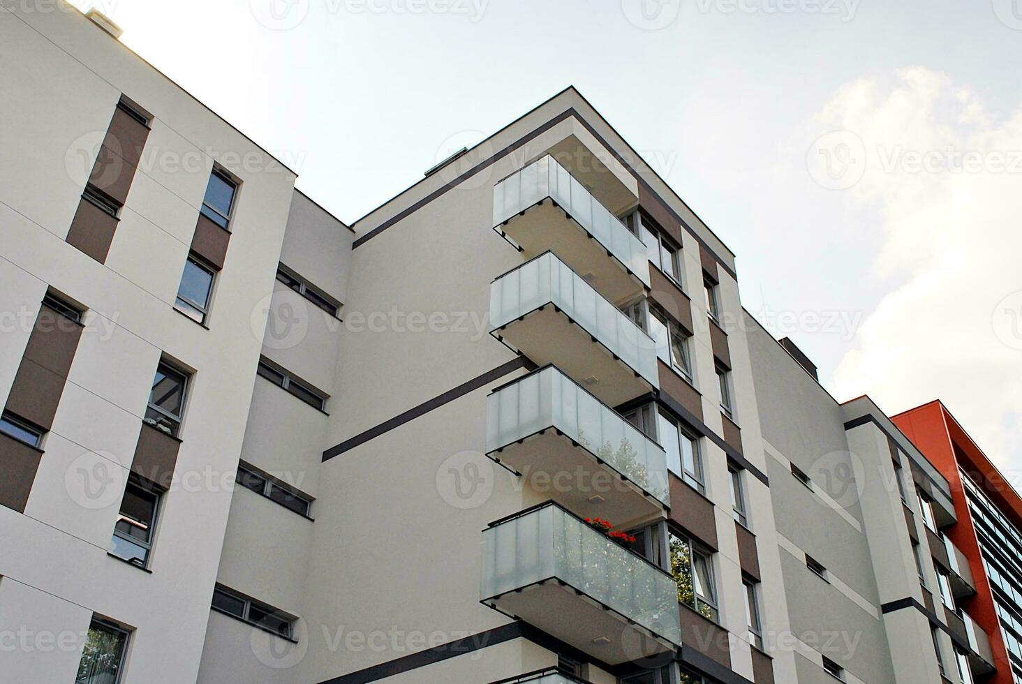 Modern apartment building in sunny day. Exterior, residential house facade. photo