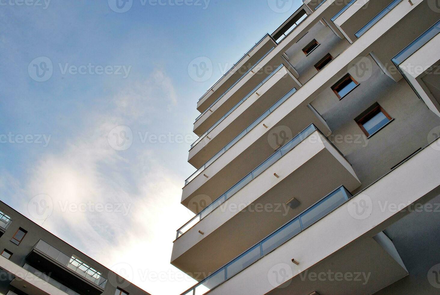 Brand new apartment building on sunny day. Modern residential architecture. Modern multi-family apartment house. photo