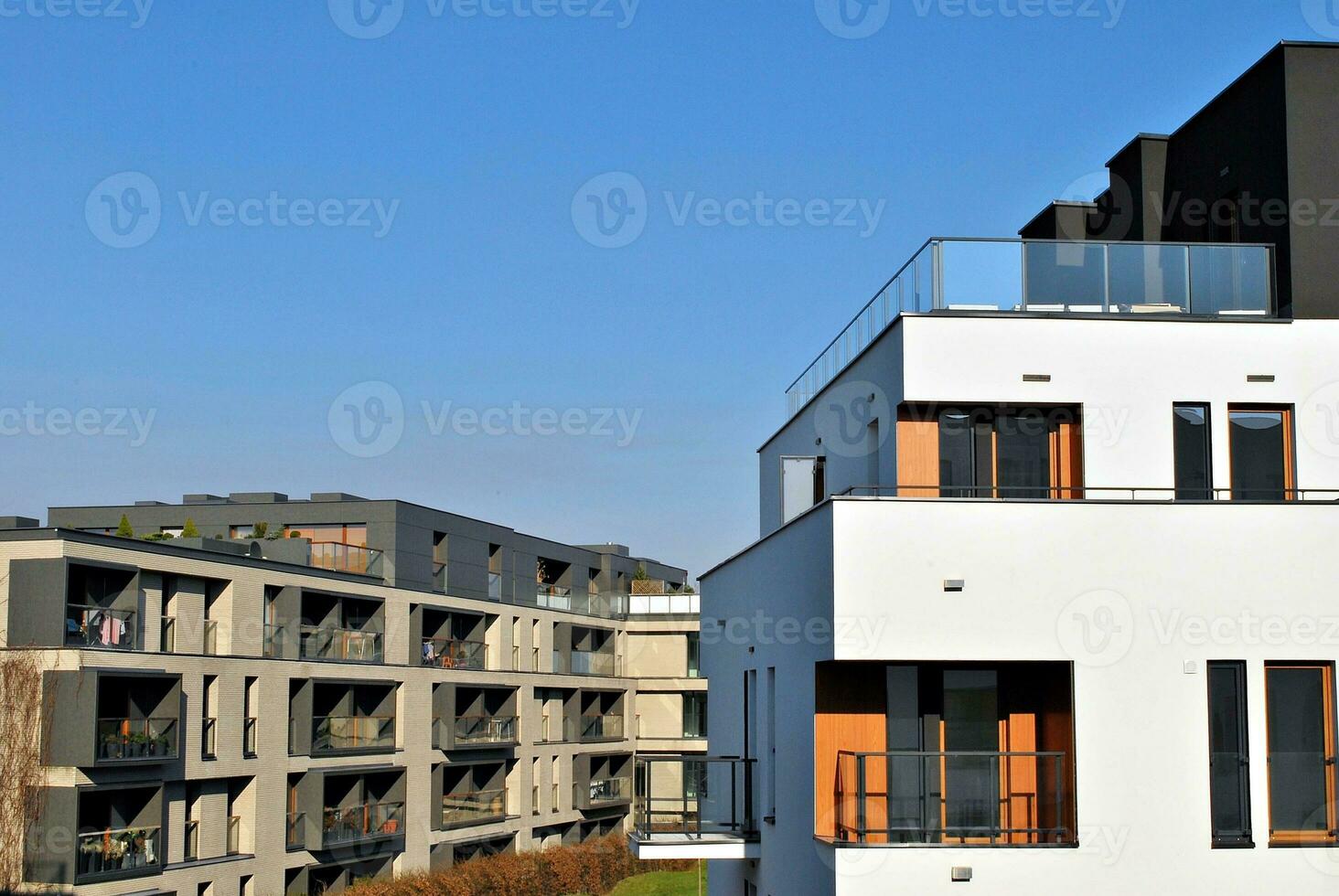 Brand new apartment building on sunny day. Modern residential architecture. Modern multi-family apartment house. photo