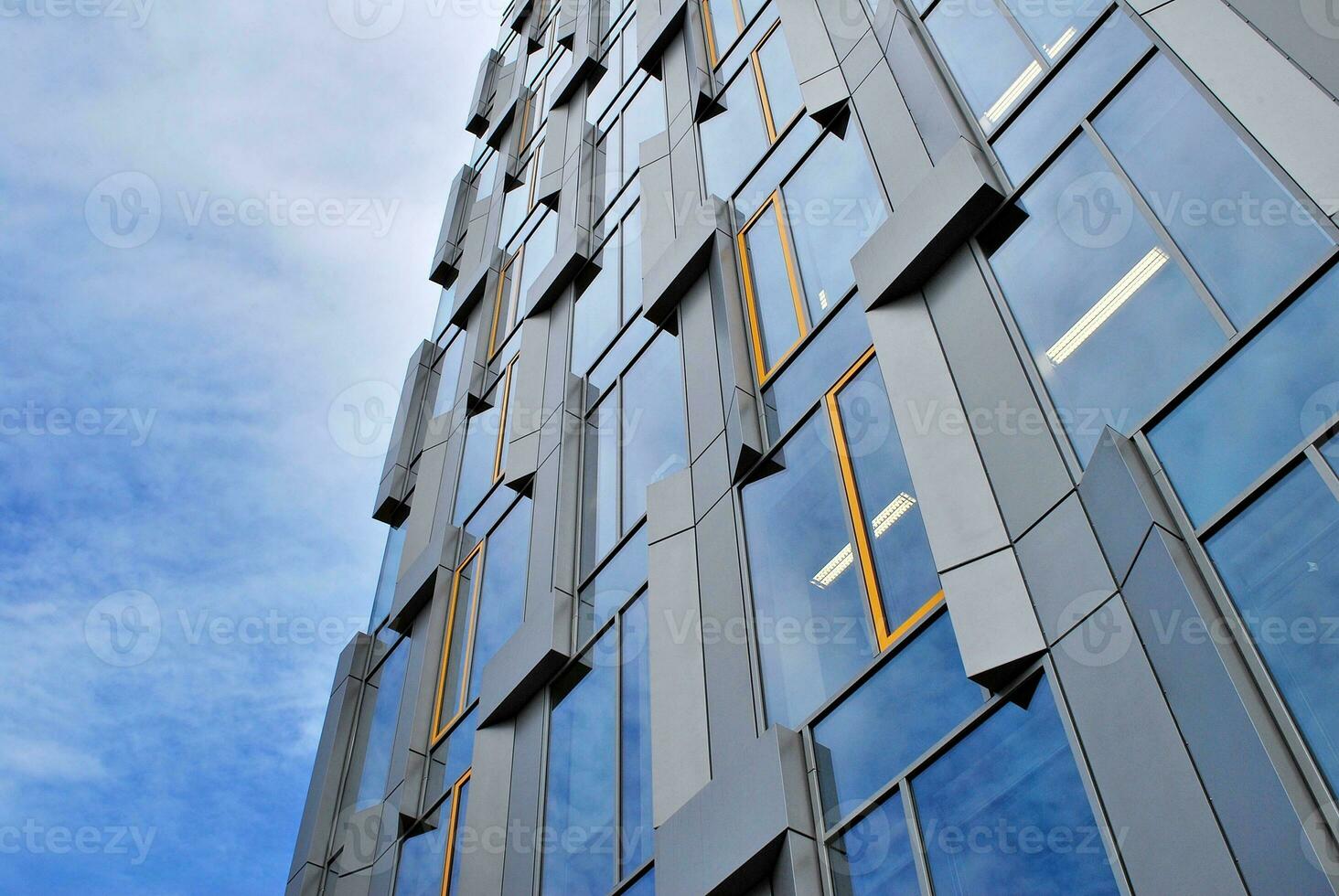 Fragment of glass and metal facade walls. Commercial office buildings. Abstract modern business architecture. photo