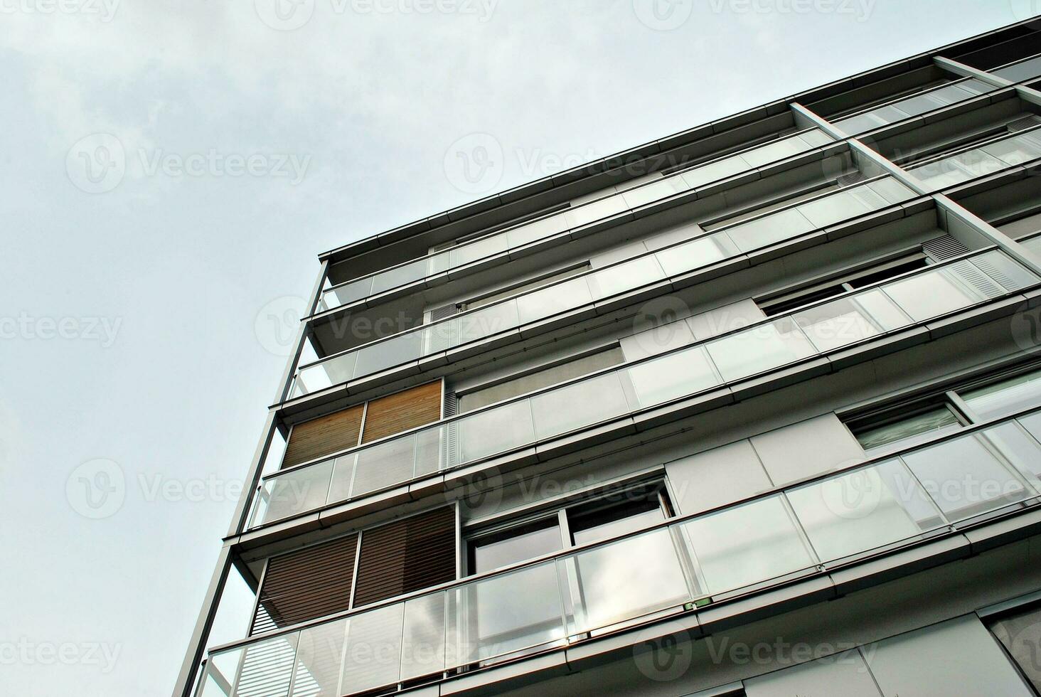 Brand new apartment building on sunny day. Modern residential architecture. Modern multi-family apartment house. photo