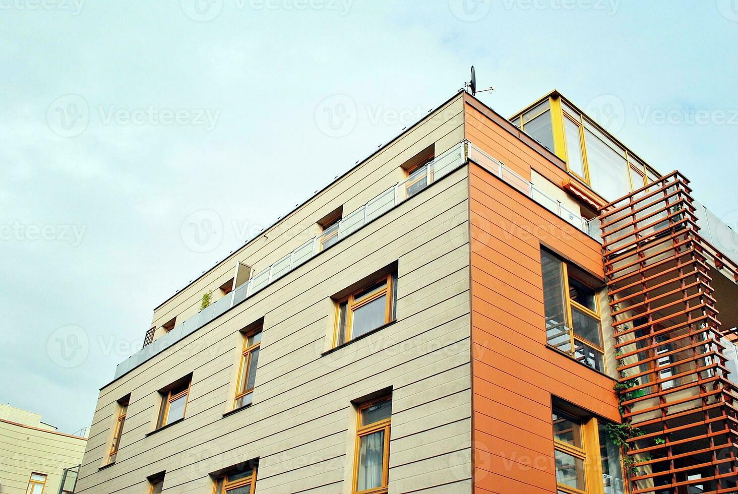 Brand new apartment building on sunny day. Modern residential architecture. Modern multi-family apartment house. photo