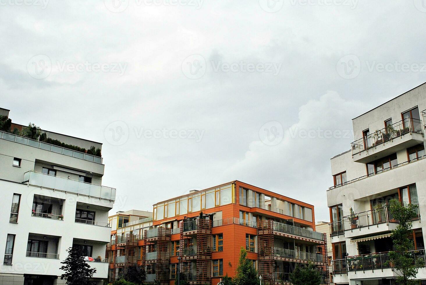 Brand new apartment building on sunny day. Modern residential architecture. Modern multi-family apartment house. photo