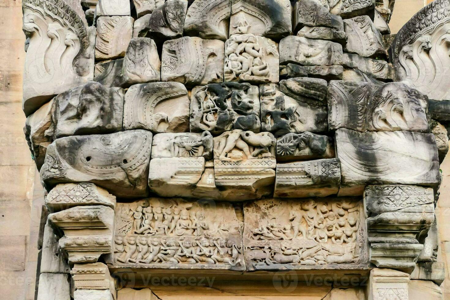 the carvings on the wall of the temple photo