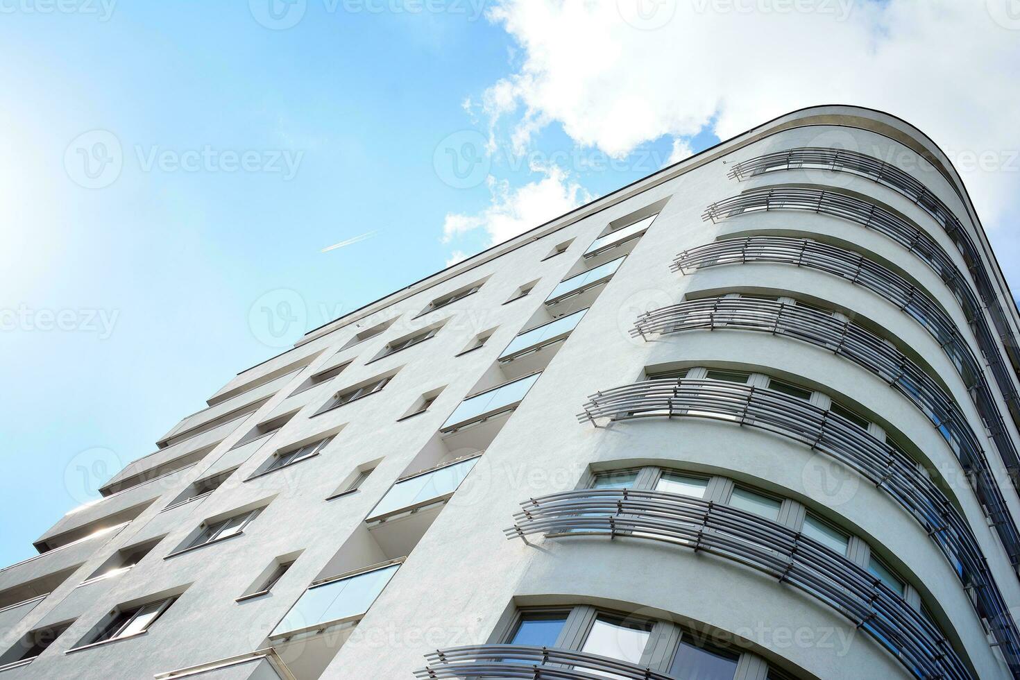 Brand new apartment building on sunny day. Modern residential architecture. Modern multi-family apartment house. photo