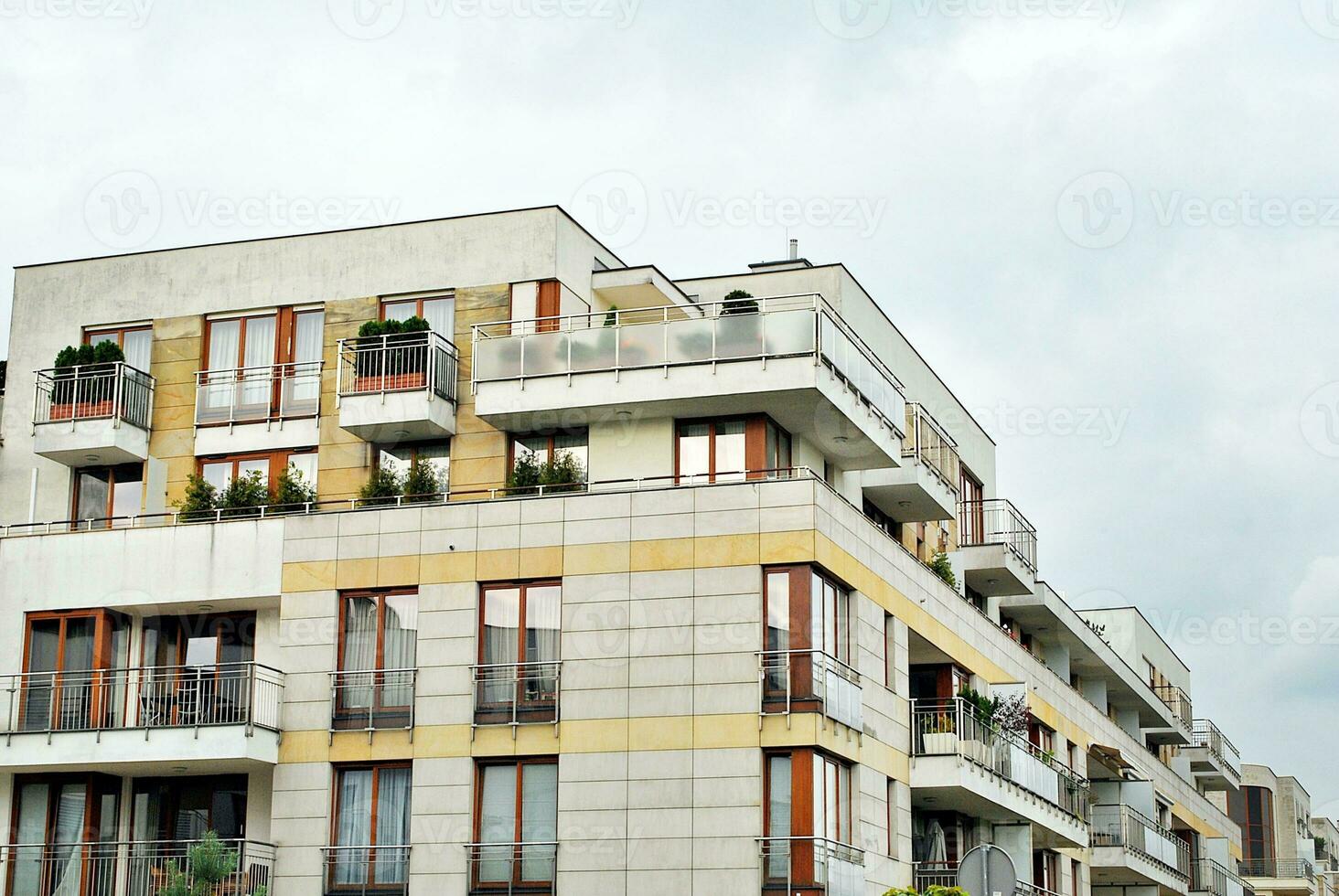 Brand new apartment building on sunny day. Modern residential architecture. Modern multi-family apartment house. photo