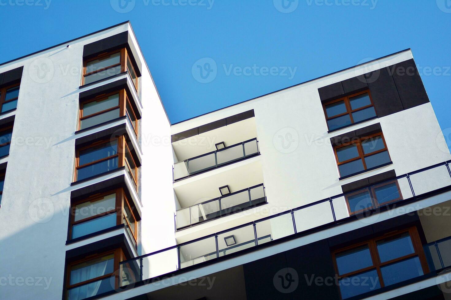 Modern apartment building in sunny day. Exterior, residential house facade. photo