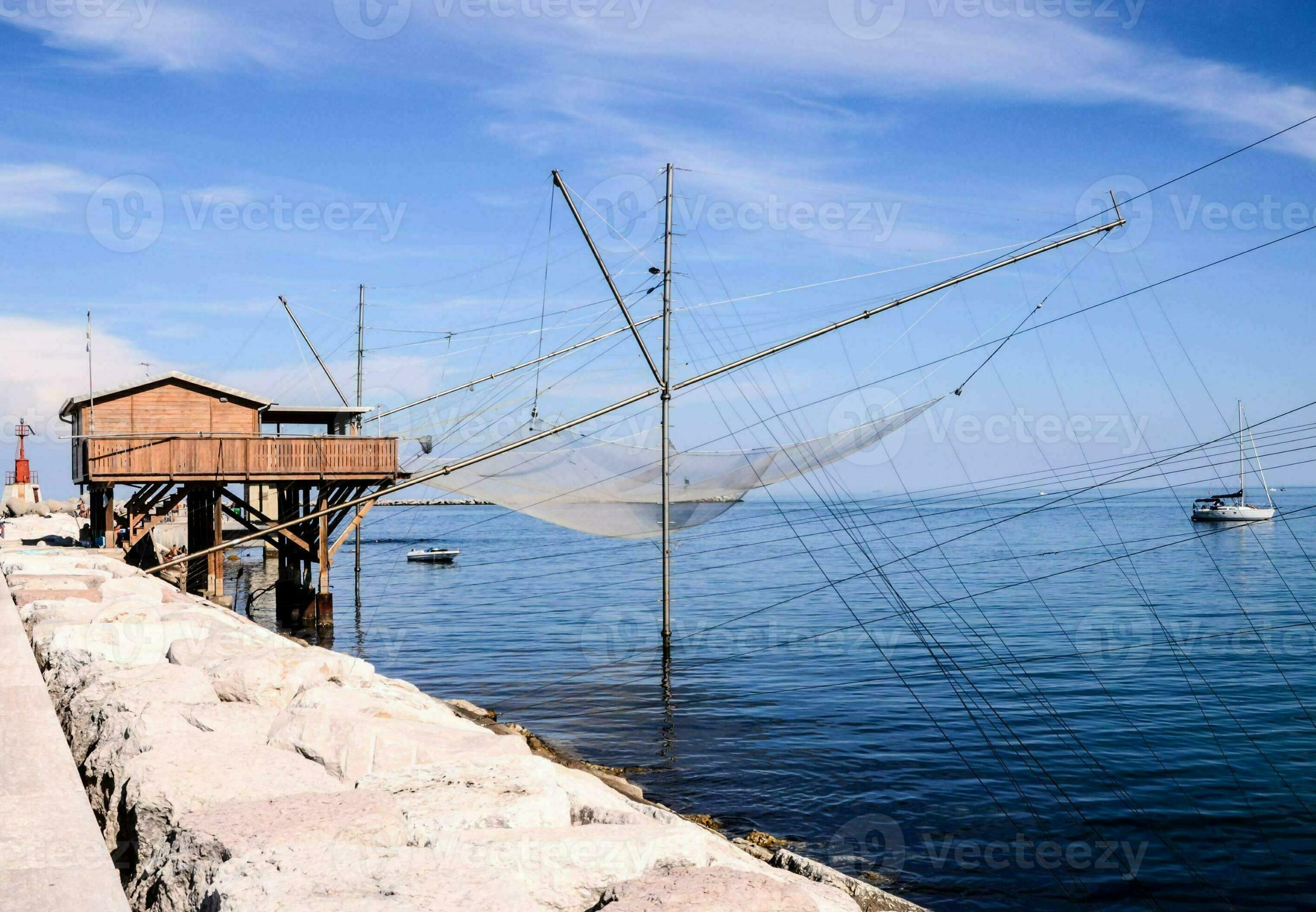 fishing nets on the pier in front of a building 35295026 Stock Photo at  Vecteezy