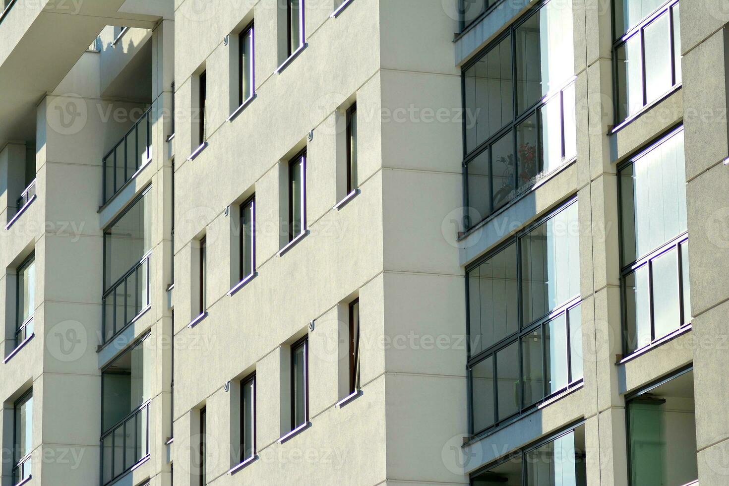 Modern apartment building in sunny day. Exterior, residential house facade. photo