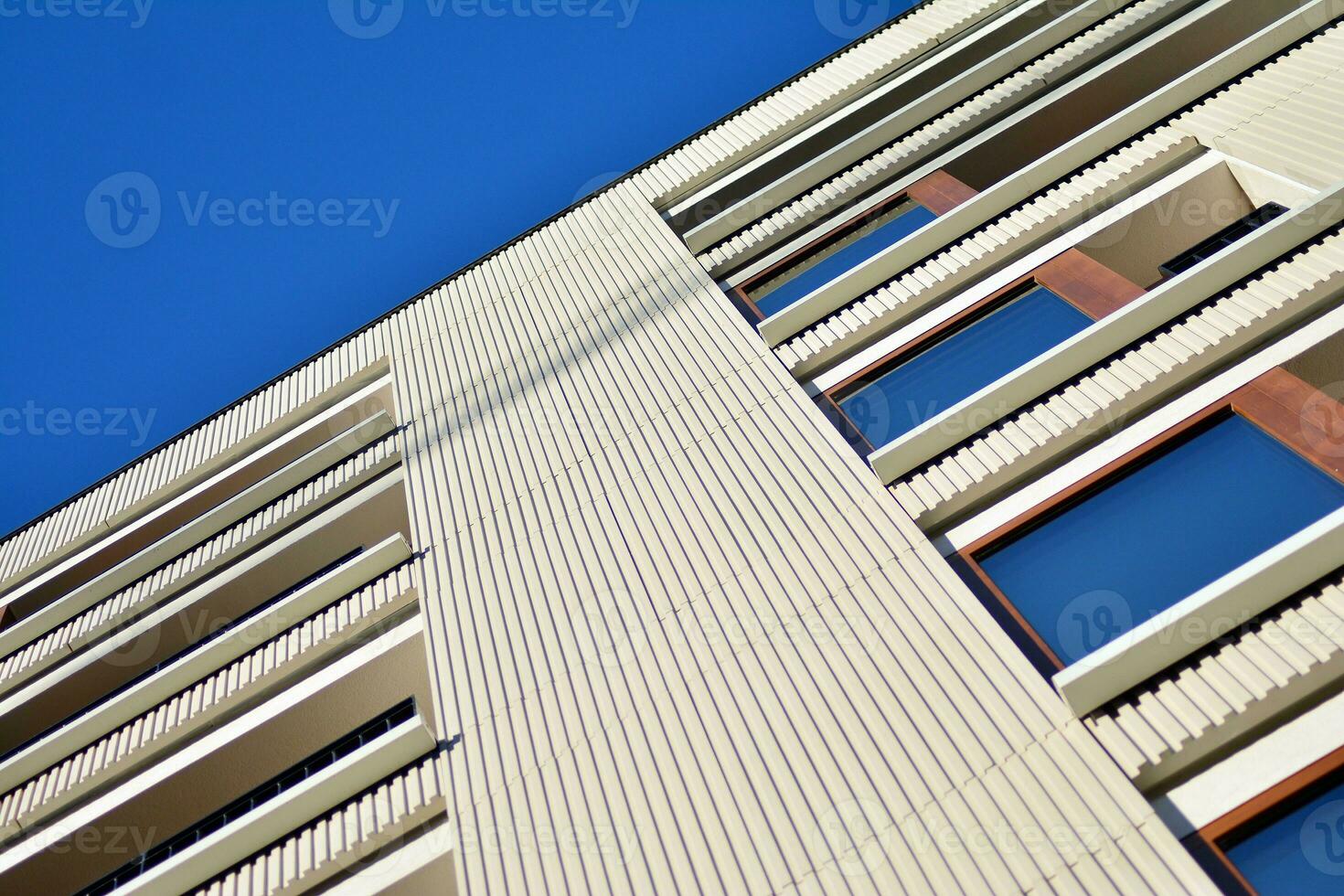 Modern apartment building in sunny day. Exterior, residential house facade. photo