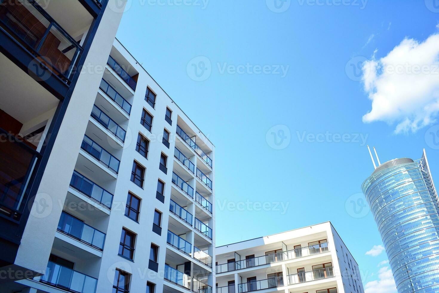 Modern apartment building in sunny day. Exterior, residential house facade. photo