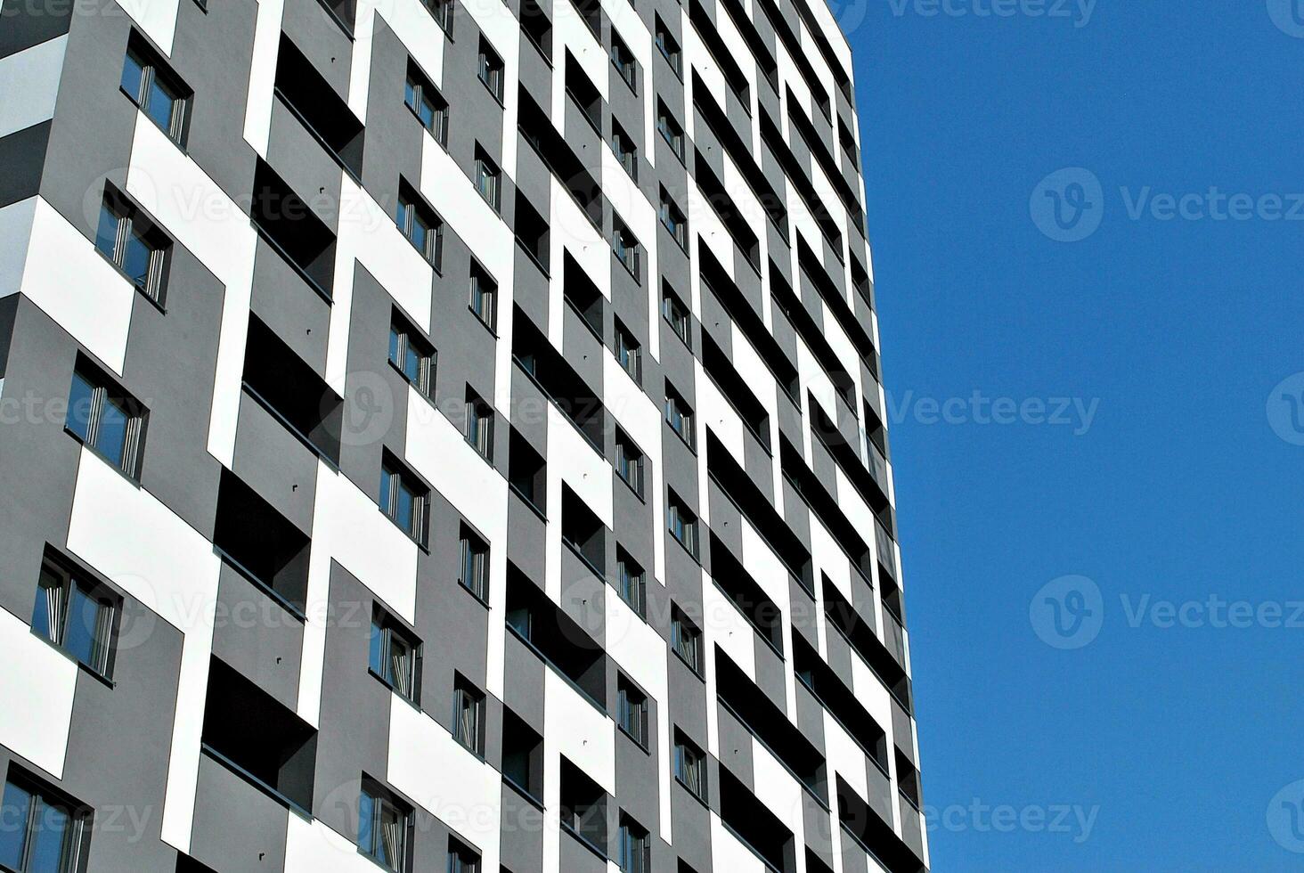 Modern apartment building in sunny day. Exterior, residential house facade. photo