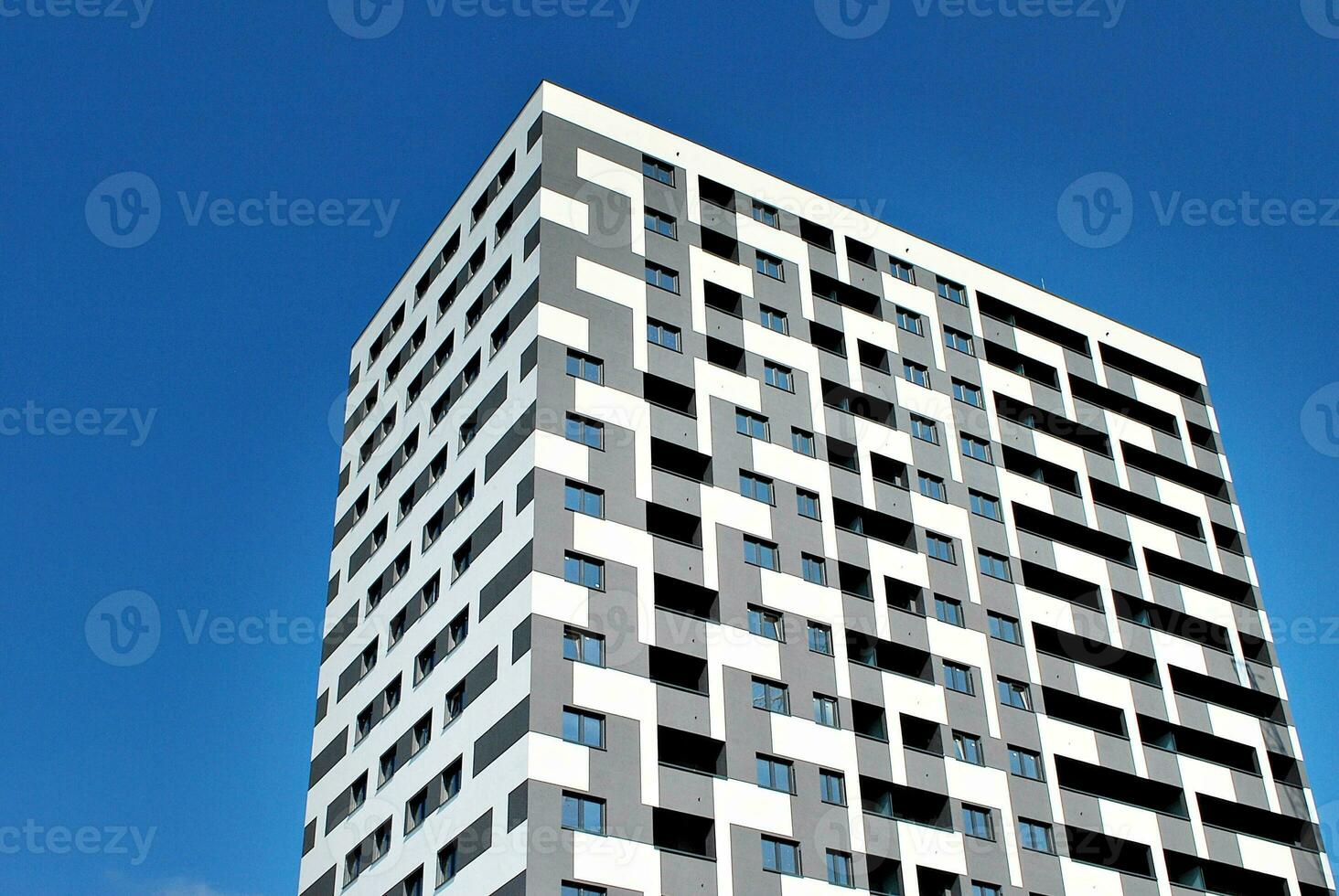 Modern apartment building in sunny day. Exterior, residential house facade. photo