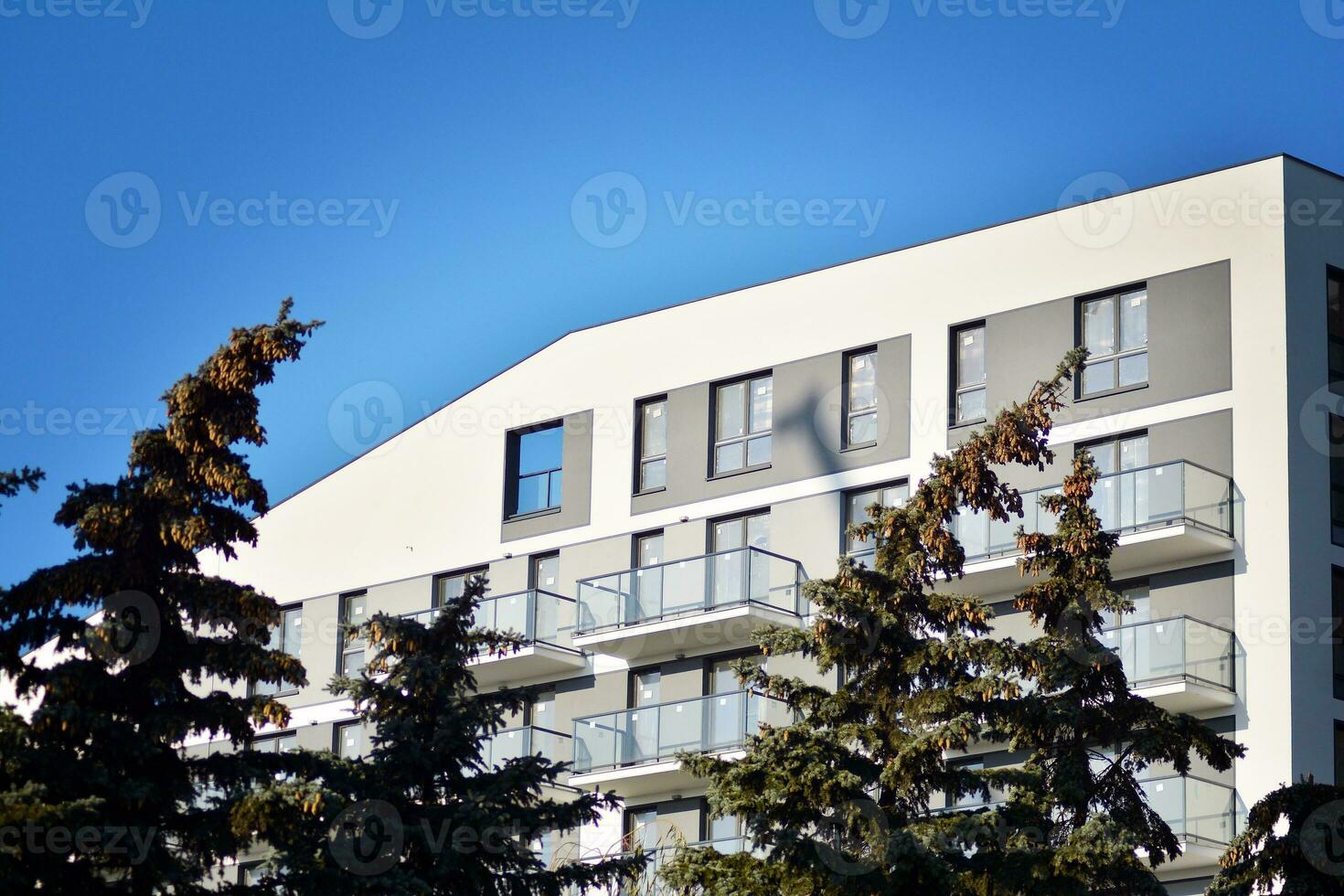 Modern apartment building in sunny day. Exterior, residential house facade. photo