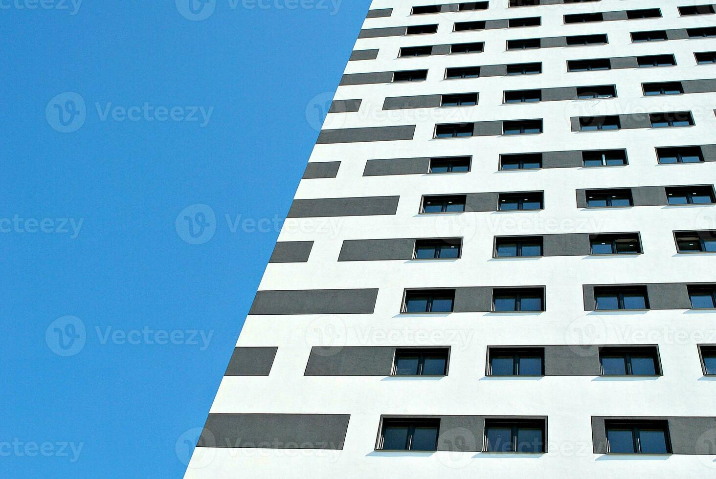 Modern apartment building in sunny day. Exterior, residential house facade. photo