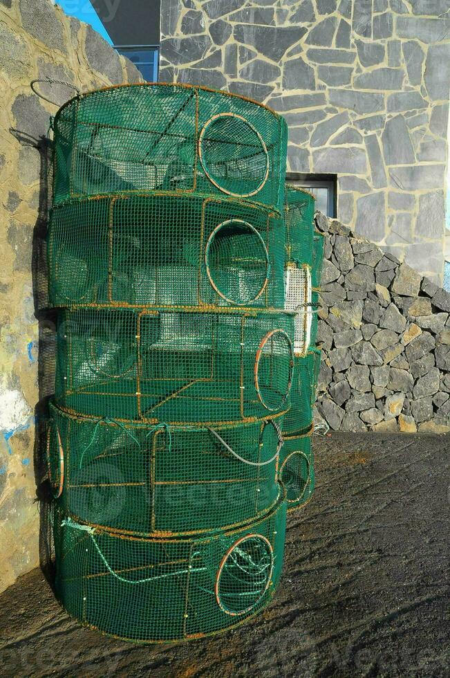 a large green cage with holes in it photo