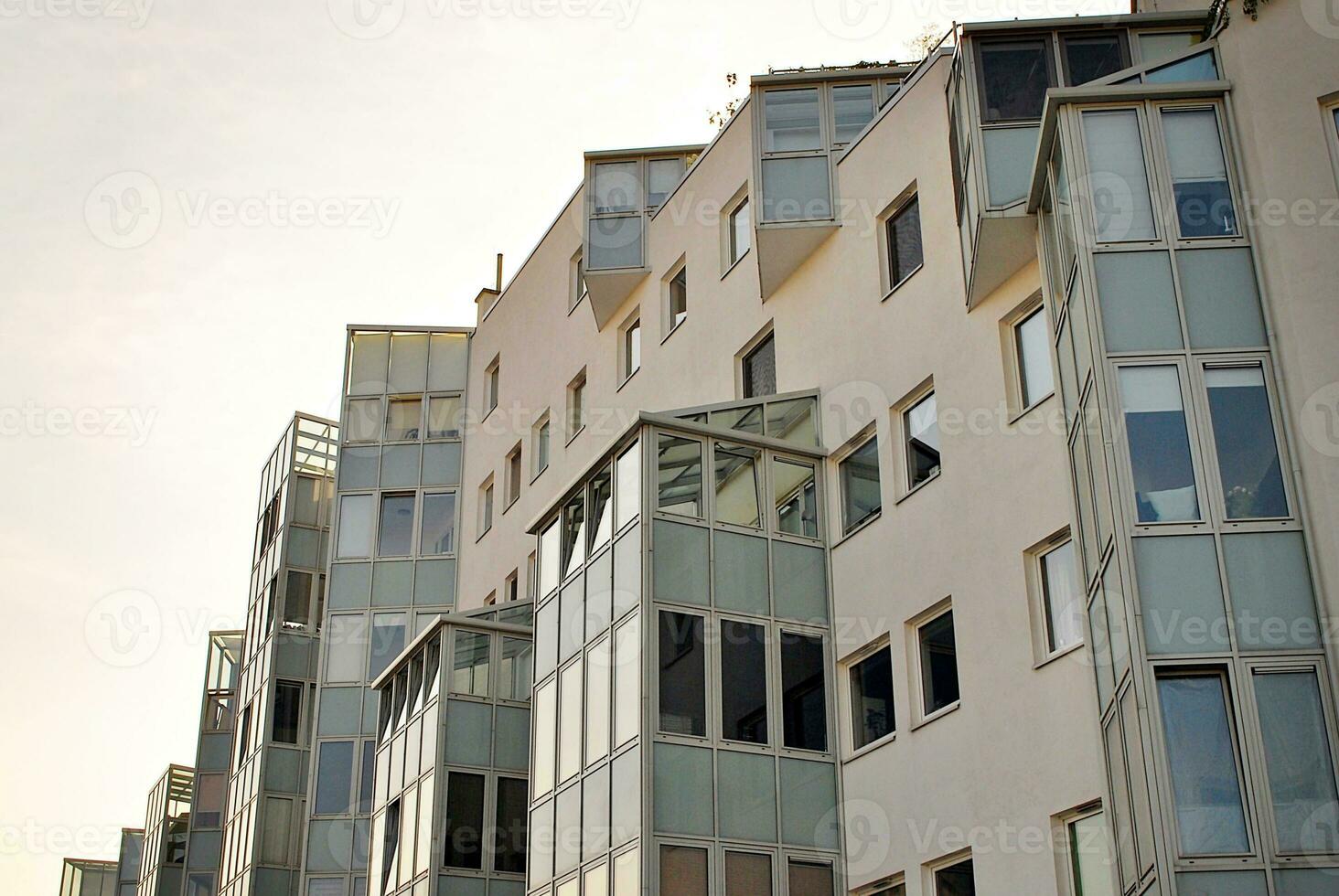 Modern apartment building in sunny day. Exterior, residential house facade. photo