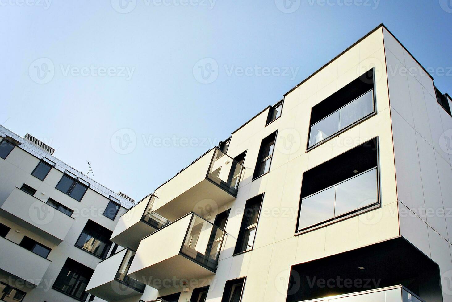 Modern apartment building in sunny day. Exterior, residential house facade. photo